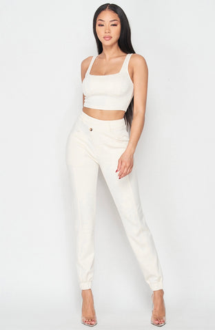 CROPPED TANK AND ASYMMETRICAL HEM JOGGERS SET 55%RAYON 40%POLYESTER 5%SPANDEX MODEL IS 5’8″ WEARING A SMALL www.ninetwentyninecouture.com